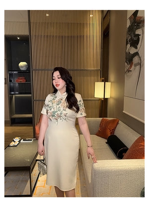 Elegant champagne embroidered plus size qipao dress, combining traditional Chinese fashion with modern flair.