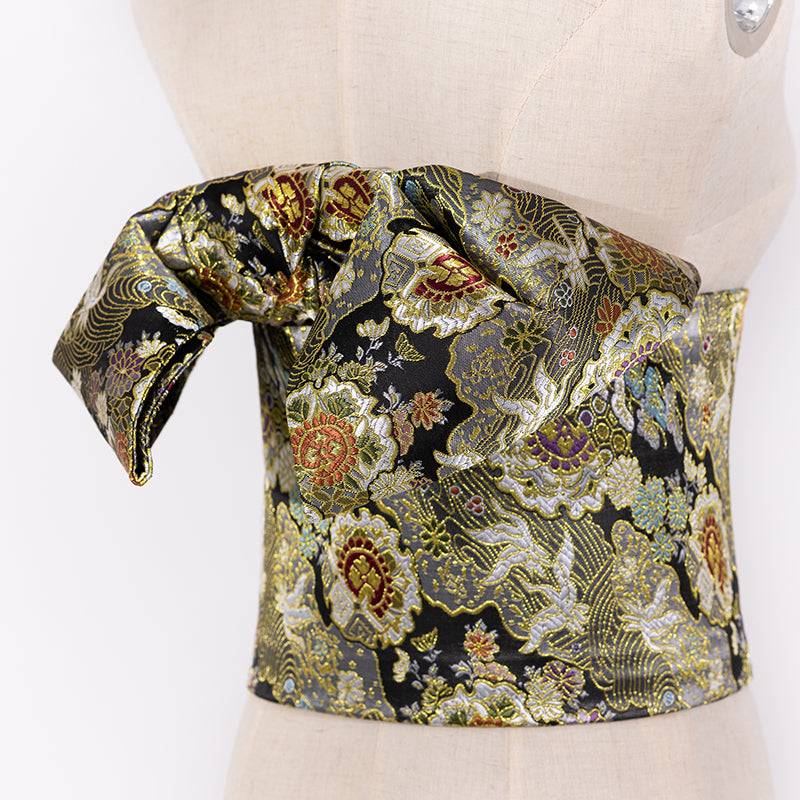 Black brocade Japanese kimono waist seal with intricate floral patterns and bow knot, ideal yukata belt for festive wear.