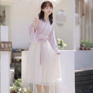 Spring-ready Pink Modern Hanfu Dress with delicate lace and wide sleeves, styled for feminine charm and cultural fashion.