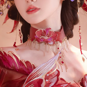Close-up of floral choker from Red Hanfu female Dunhuang embroidery fairy spring and summer dress with gold and red accents.