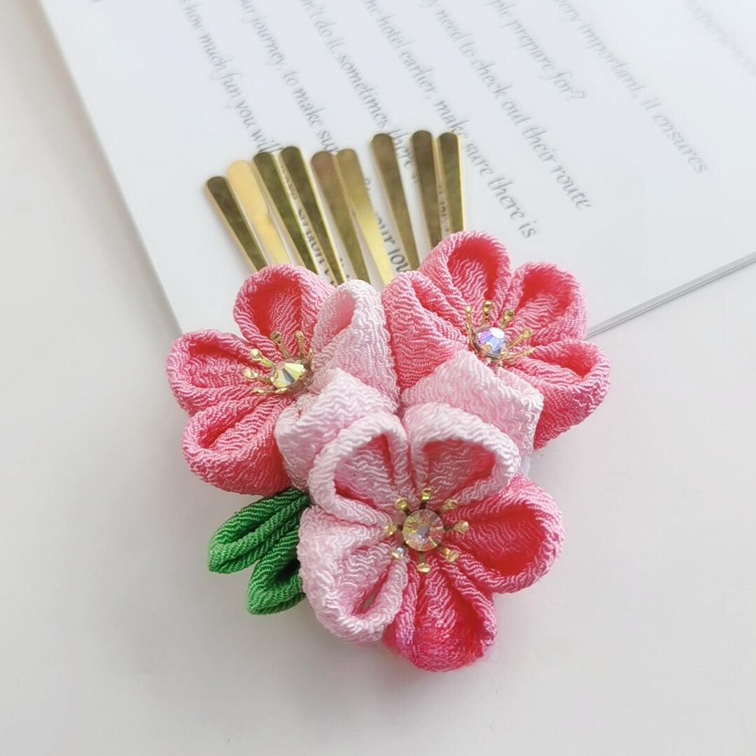 Gold comb hairpin with vibrant pink and white cherry blossoms, ideal for Lolita or kimono fashion.