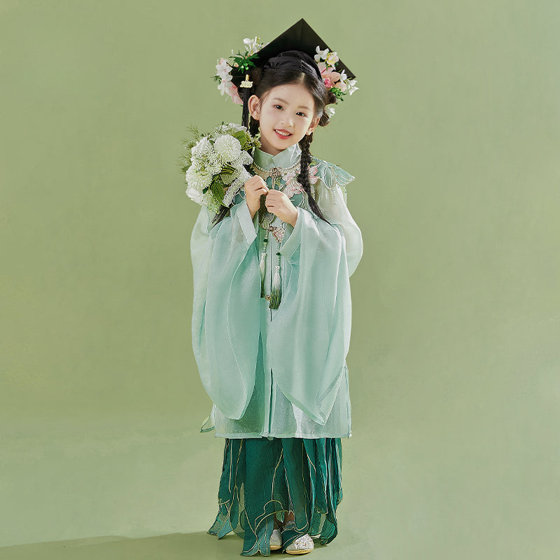 Green girls Hanfu 2025 children's ancient clothing Chinese style supe with floral headpiece and graduation cap, holding bouquet in traditional pose.