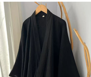 Crossover collar construction on the solid black cotton gauze robe