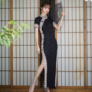 Black lace cheongsam with pale scalloped trim, short sleeves and a high side slit