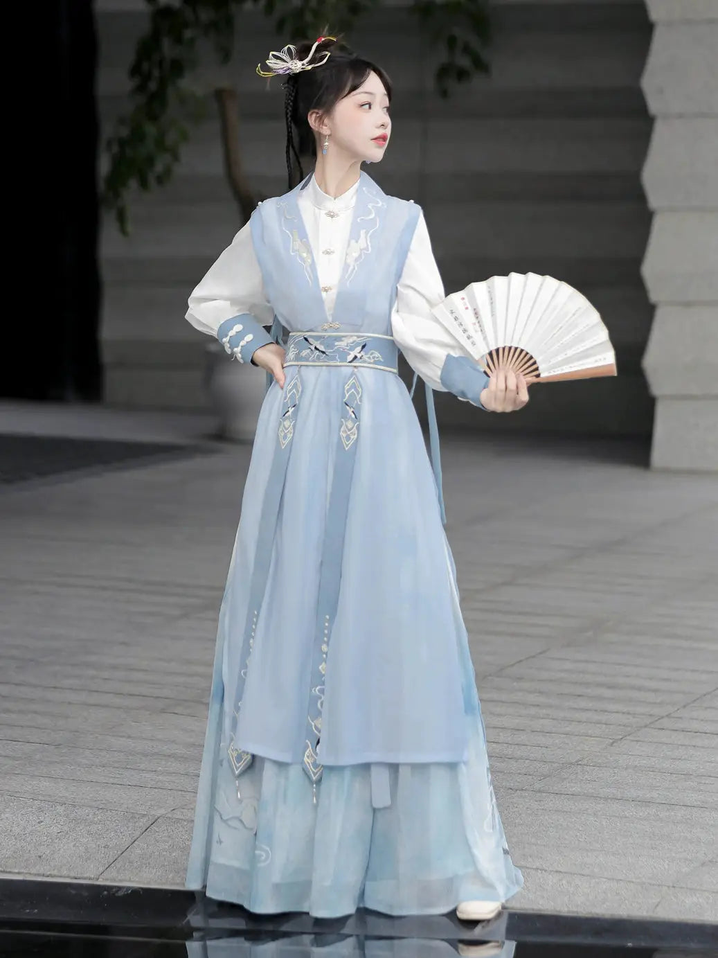 Blue hanfu dress for women, blending traditional Song Dynasty and modern Chinese styles, crafted from luxurious silk. This versatile hanfu includes options for a matching coat or jacket, making it suitable for winter wear, Chinese New Year celebrations, or casual outings. Ideal for occasions like graduations or cosplay, this dress embodies the fairy-inspired elegance of classic hanfu while also drawing from martial arts clothing and contemporary Chinese fashion. Available for purchase in our online hanfu sh