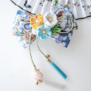Blue floral Japanese kimono hair accessory with yellow, white, and aqua flowers, finished with tassels for a vibrant lolita look.