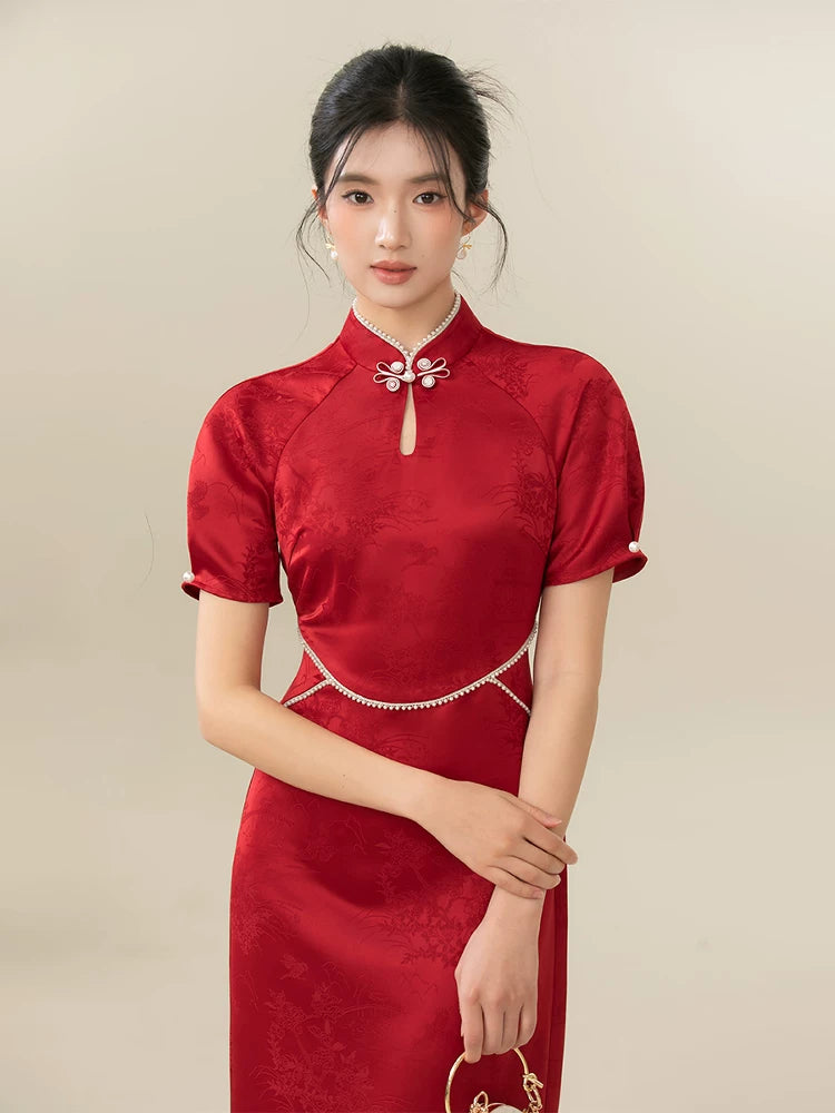 Ceremonial Red jacquard engagement qipao dress shown as a polished red Chinese wedding qipao, highlighting rich jacquard texture, fitted cheongsam shape and engagement-ready red color.
