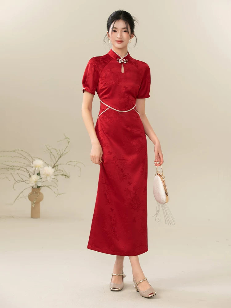 Front styling view of the Ceremonial Red jacquard engagement qipao dress, with rich jacquard texture, fitted cheongsam shape and engagement-ready red color.