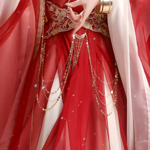 Close-up of the red outfit waist sash and styling chains