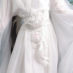 Close-up of the white decorative waist sash