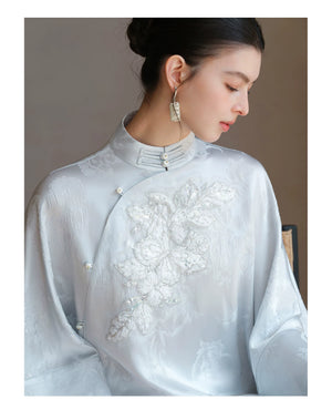 Occasion styling image of the Cloud-Mist Blue embroidered satin top and skirt, presented as an elegant New Chinese Style outfit.