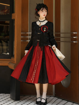 Cropped black jacket over a pleated red-and-black skirt