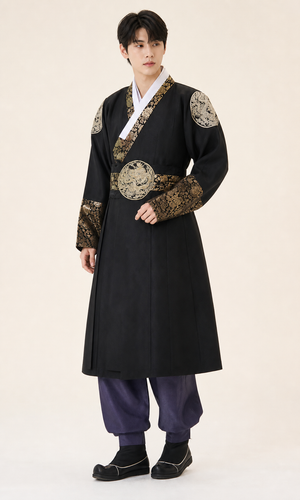 Men's dark Yanji Korean hanbok robe with black fabric, gold brocade collar, shoulder patches and circular waist panel