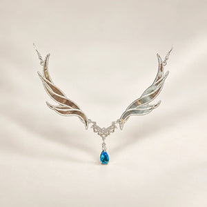 Blue-accent forehead ornament with wing-shaped sides