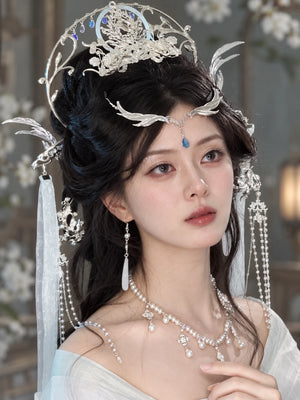 Dragon crown and cascading hair ornaments on a model