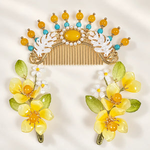 Yellow floral clips beside the matching comb