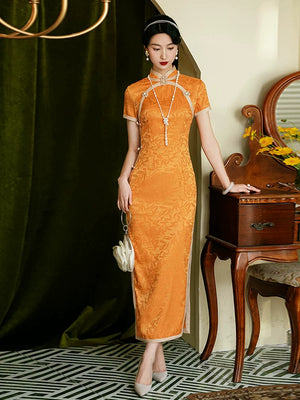 Front view of an orange floral qipao with short sleeves and decorative curved chest trim