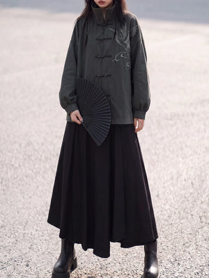 Full-length styling view of the charcoal stand-collar jacket