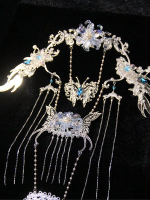 Ice Blossom back tassel ornament displayed on a stand