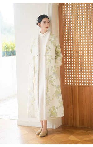 Close product view of the Ivory-Green woven floral wool-blend long coat, focused on its Chinese-inspired design details.