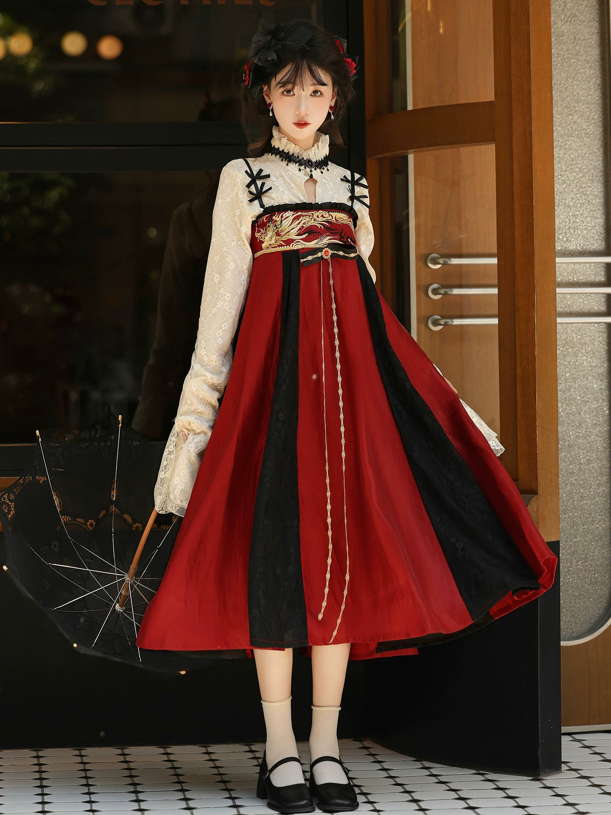Ivory lace blouse with red-and-black chest-high skirt