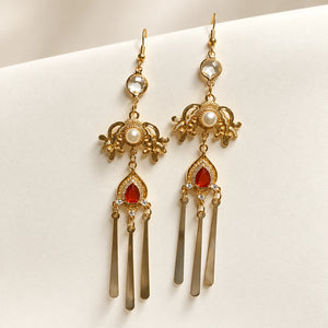 Long matching earrings with red accents
