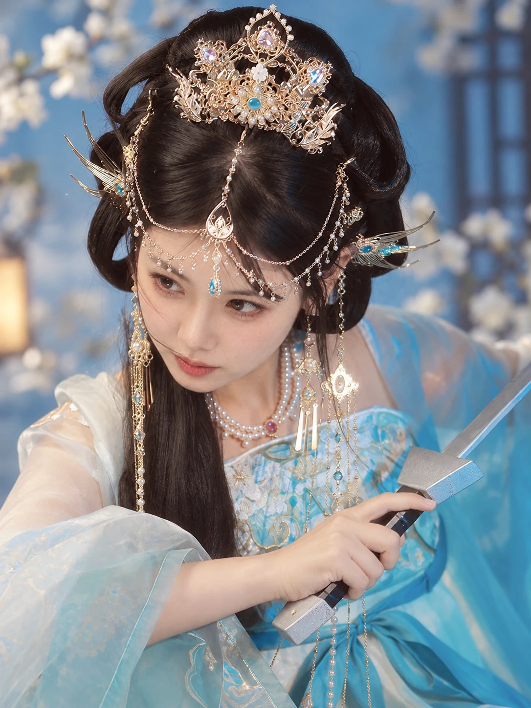 Side portrait showing crown and forehead chains