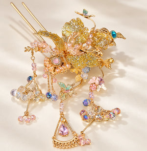 Gold-tone floral hairpin with bead and tassel details