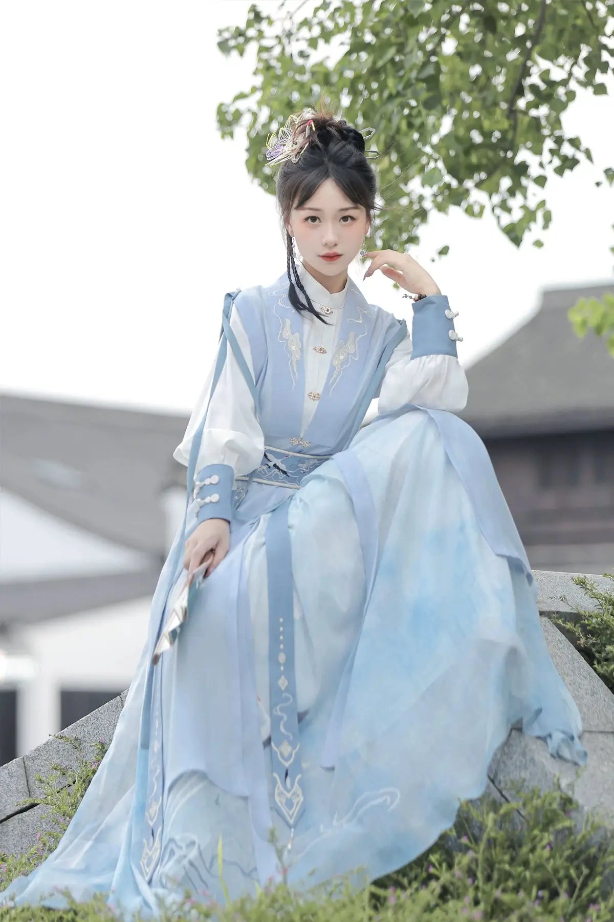 Blue hanfu dress for women, blending traditional Song Dynasty and modern Chinese styles, crafted from luxurious silk. This versatile hanfu includes options for a matching coat or jacket, making it suitable for winter wear, Chinese New Year celebrations, or casual outings. Ideal for occasions like graduations or cosplay, this dress embodies the fairy-inspired elegance of classic hanfu while also drawing from martial arts clothing and contemporary Chinese fashion. Available for purchase in our online hanfu sh
