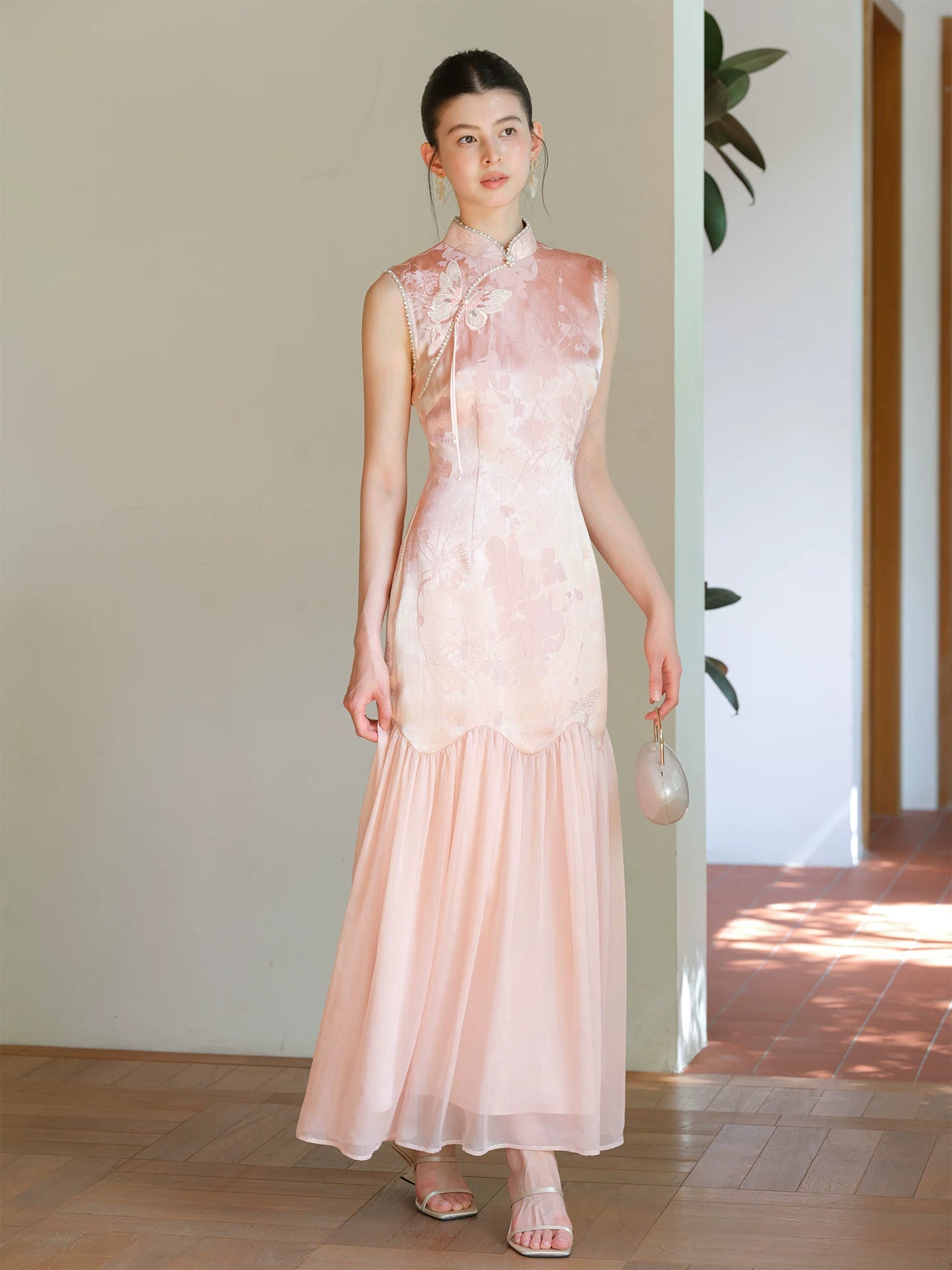 Misty Blush floral jacquard cheongsam dress shown as a polished modern pink qipao dress, highlighting floral jacquard texture, fitted waist and elegant long silhouette.
