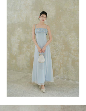 Design view of the Moonlight Blue embroidered A-line slip dress, highlighting delicate embroidery, clean A-line shape and elegant blue palette.