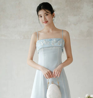 Detailed product image of the Moonlight Blue embroidered A-line slip dress, showing fabric texture, finish and craftsmanship.