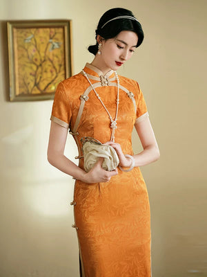 Orange short-sleeve qipao with a subtle floral pattern, stand collar and curved pale trim