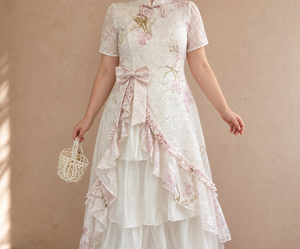 Pink faux two-piece Chinese dress close detail of collar bow, waist bow and ruffle layers