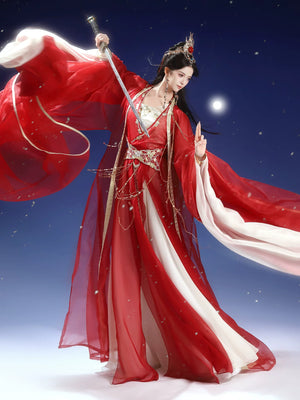 Red wide-sleeve robe in motion over an ivory dress