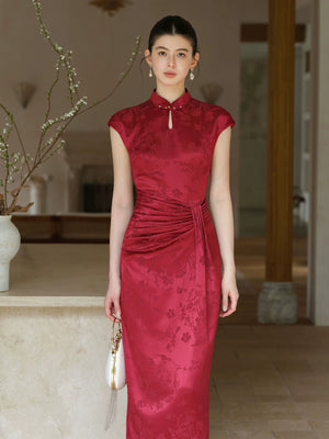 Three-quarter product view of the Ruby Red acetate jacquard pleated qipao dress, a refined modern red qipao dress for elegant occasions.