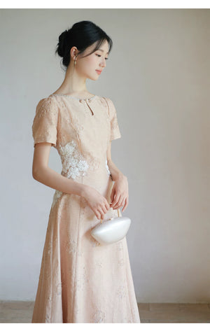 Occasion styling image of the Soft Sand Pink floral applique cheongsam dress, presented as an elegant modern pink qipao dress.