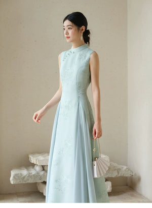 Occasion styling image of the Water-Blue jacquard A-line qipao dress, presented as an elegant modern blue qipao dress.