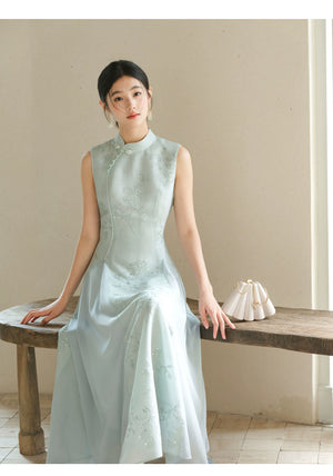 Water-Blue jacquard A-line qipao dress styled to show its fit and drape, including jacquard texture, Chinese collar and graceful A-line cheongsam silhouette.