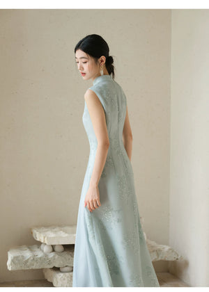 Occasion styling image of the Water-Blue jacquard A-line qipao dress, presented as an elegant modern blue qipao dress.