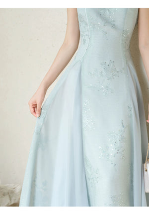 Additional styling view of the Water-Blue jacquard A-line qipao dress, showing the garment's shape, texture and finish.