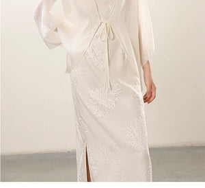 Occasion styling image of the White embroidered slip dress and sheer outer layer, presented as an elegant white New Chinese Style outfit.