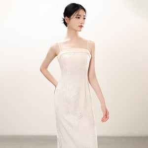 White embroidered slip dress and sheer outer layer shown as a polished white New Chinese Style outfit, highlighting embroidered slip dress, translucent outer layer and soft layered drape.