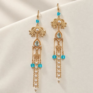 Long matching earrings with blue accents