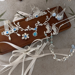 Close view of blue accents and fine metalwork on Yueling hair accessories