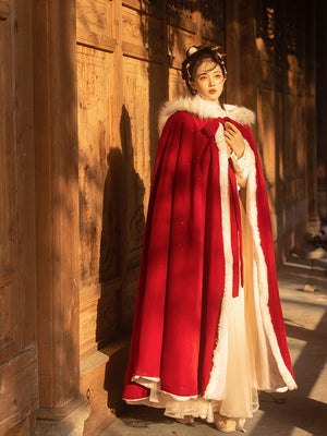 Red Hanfu Cape Featuring a diverse collection of Hanfu styles, this display presents a blend of traditional and modern elements, from the intricate embroidery of classic Hanfu to contemporary menswear. The assortment includes authentic Tang Dynasty dresses and detailed Ming Dynasty Hanfu, alongside luxurious royal attire and scholar officials' outfits. With a special emphasis on men's Hanfu, the exhibit highlights the rich cultural tapestry of traditional Asian clothing and modern, Asian-inspired fashion