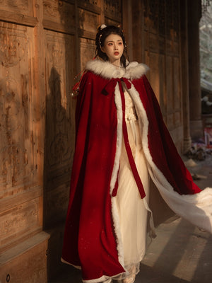 Red Hanfu Cape Featuring a diverse collection of Hanfu styles, this display presents a blend of traditional and modern elements, from the intricate embroidery of classic Hanfu to contemporary menswear. The assortment includes authentic Tang Dynasty dresses and detailed Ming Dynasty Hanfu, alongside luxurious royal attire and scholar officials' outfits. With a special emphasis on men's Hanfu, the exhibit highlights the rich cultural tapestry of traditional Asian clothing and modern, Asian-inspired fashion