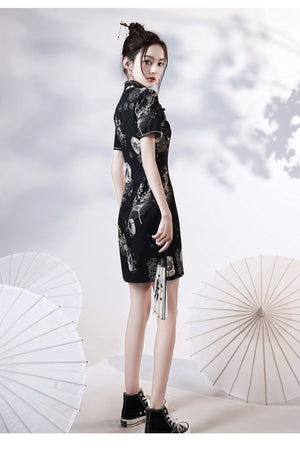 Black | Modern Chinese Qipao 【国潮】A stunning black modern Chinese Qipao dress featuring a form-fitting silhouette and intricate embroidery. The dress also features a side slit, adding a touch of glamour to this already elegant look. Perfect for special events, weddings, or a night out, this dress embodies the fusion of traditional Chinese fashion with modern elements. Shop now to upgrade your wardrobe with this beautiful and timeless piece of modern Chinese fashion.