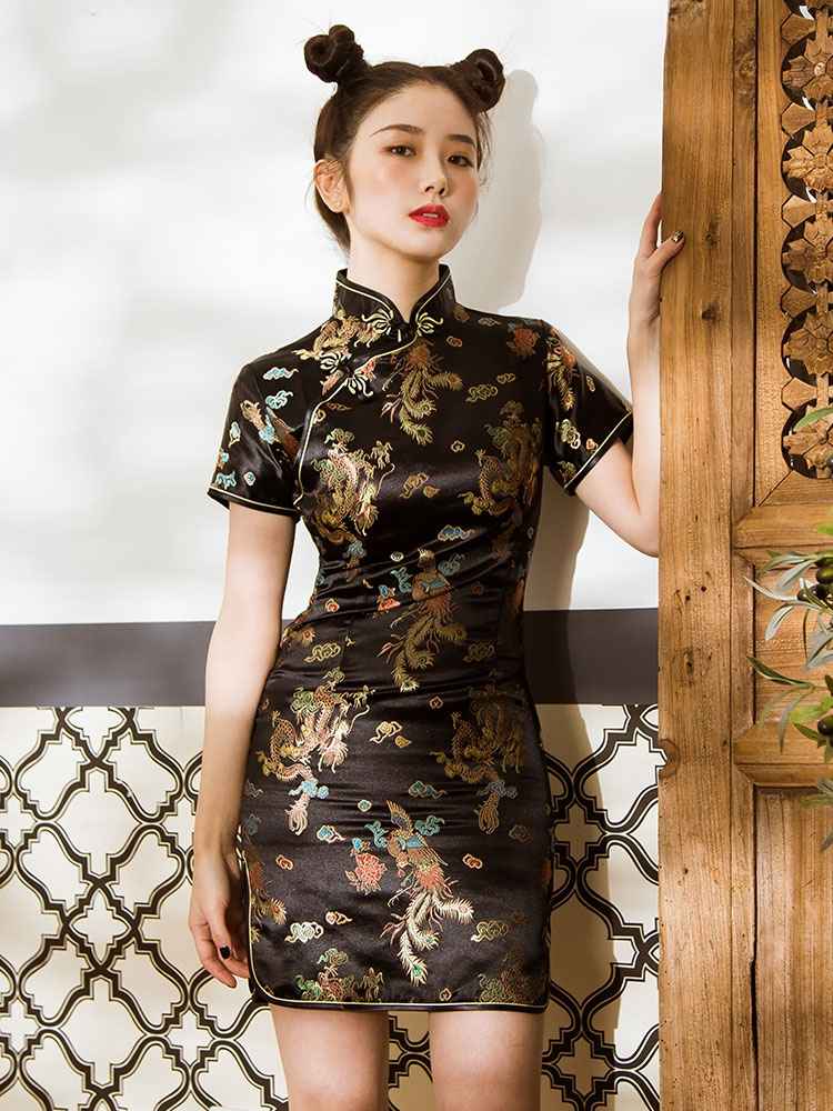 Black/Blue Modern Qipao Featuring an elegant display of an array of items including a Green Qipao dress, a modern Qipao shirt and a sexy Cheongsam, this collection presents a blend of traditional and modern styles. The modern Cheongsam dress, along with the Cheongsam modern top, redefines traditional aesthetics with a contemporary twist. Adding an element of allure is the sexy Cheongsam lingerie, complemented by a Cheongsam shirt in comfortable fabric.