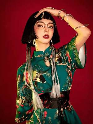 Featuring an elegant display of an array of items including a Green Qipao dress, a modern Qipao shirt and a sexy Cheongsam, this collection presents a blend of traditional and modern styles. The modern Cheongsam dress, along with the Cheongsam modern top, redefines traditional aesthetics with a contemporary twist. Adding an element of allure is the sexy Cheongsam lingerie, complemented by a Cheongsam shirt in comfortable fabric.